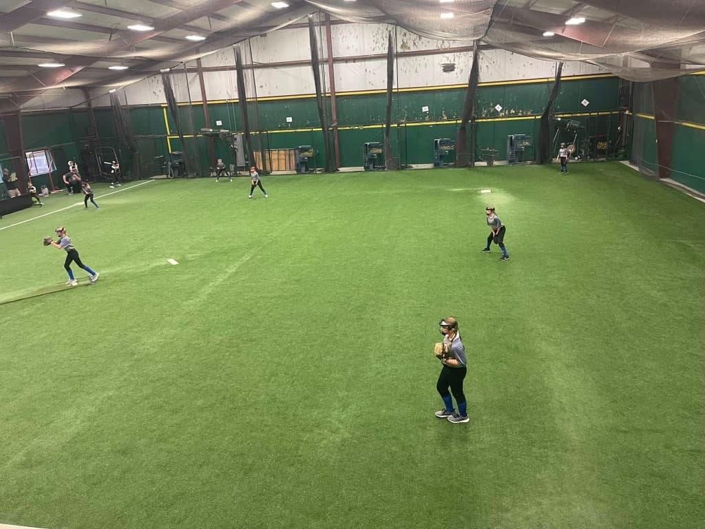 Players training on the Sluggers indoor turf field